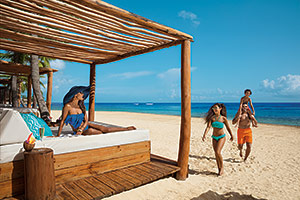 Family on beach, Dreams Resorts 